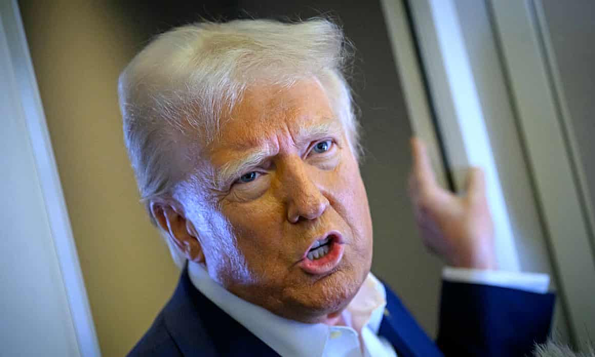 Donald Trump speaks aboard Air Force One on Sunday.