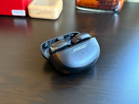 Open earbuds let you tune in without tuning out the world. Here are the five best pairs | headphones Bose earbuds in case sitting on table