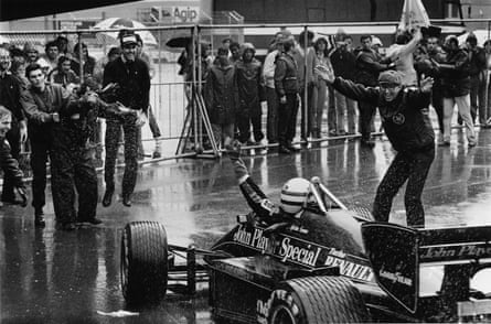 Lotus sporting head Peter Warr celebrates pinch Ayrton Senna.