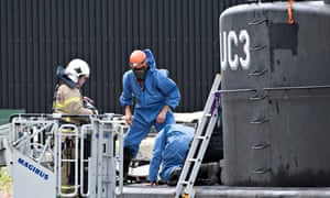Danishpolice technicians investigate the recovered privately owned submarine Nautilus UC3.