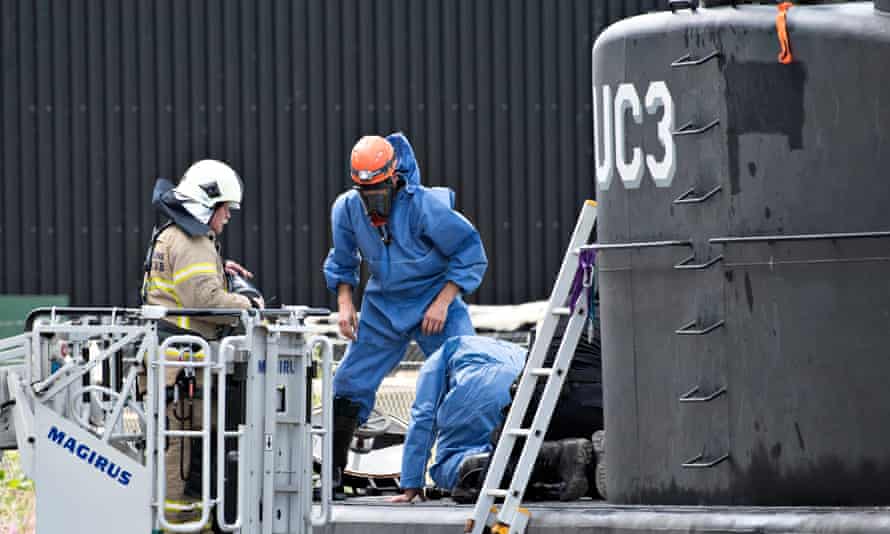 Danish police technicians investigate the recovered privately owned submarine Nautilus UC3.