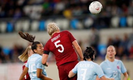 Millie Bright of England rises highest to score the seventh goal.