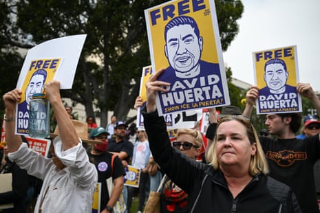 people hold up signs in protest
