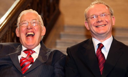 Northern Ireland’s first minister Ian Paisley, left, and deputy first minister Martin McGuinness smile after being sworn in at the Northern Ireland Assembly in Stormont in May 2007.