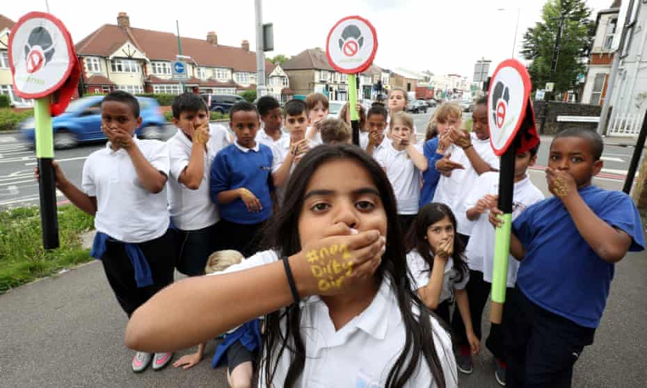 Pupils from Bowes Primary School in Enfield, north London campaign outside their school, which is adjacent to the busy North Circular ring road