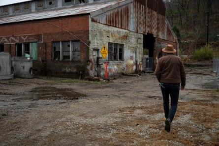 Jacob Hannah, CEO of Coalfield Development, walks towards the Black Diamond warehouse, a large industrial site that was the subject of a multimillion-dollar redevelopment that was halted, photographed on November 19 in Huntington, West Virginia. The delay was initially caused by grant suspensions and more recently by the federal shutdown, which slowed down payments.