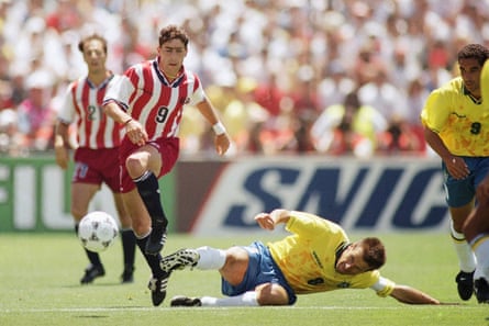 United States soccer player Tab Ramos, left, tries to avoid the sliding tackle from Brazil’s Dunga (8) during a second-round World Cup soccer match, Monday, July 4, 1994