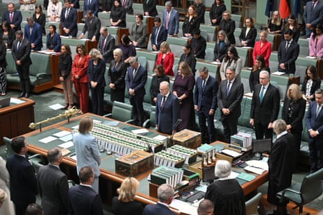 Prime Minister Anthony Albanese and parliamentarians stand for a minute’s silence.