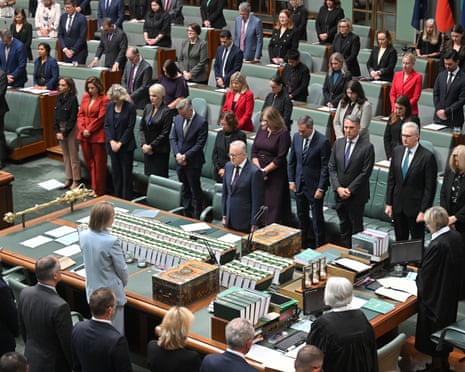 Prime Minister Anthony Albanese and parliamentarians stand for a minutes silence during a condolence motion.