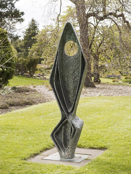 A metal sculpture by Barbara Hepworth in a garden