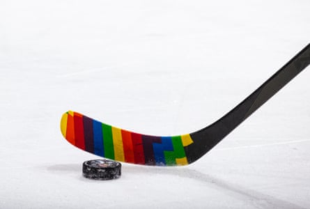 A Canucks player uses Pride tape on his stick during a 2024 game in Vancouver, British Columbia.