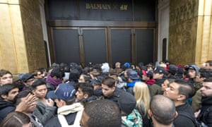 Customers wait outside H&amp;M’s Regent Street store ahead of the Balmain x H&amp;M launch in London, November 2015