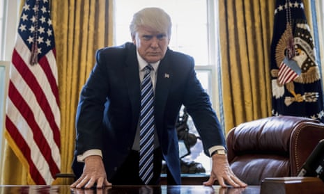 President Donald Trump in the Oval Office last Friday, in a portrait to mark his 100th day in office, which will be on 29 April.