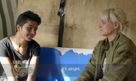 Lily Allen meets a 13-year-old boy from Afghanistan during her visit to the Calais refugee camp in October 2016.