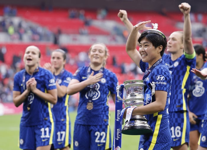 Chelsea’s Ji So-yun, who made her last appearance for the club in the final, celebrates with the trophy.