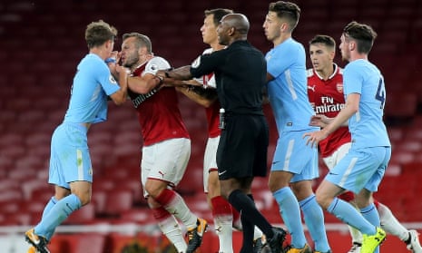 Arsenal’s Jack Wilshere grapples with Manchester City’s Tyreke Wilson during an under-23 game and after which they were both sent off.