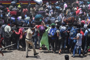 Police disperse migrant workers trying to board a special train