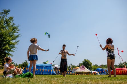 People in a field poi spinning