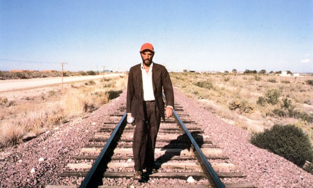 Harry Dean Stanton walking along a rail track in Paris, Texas (1984).