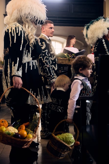 Michael Goodwin stood with other pearlies holding baskets of fresh fruit and veg