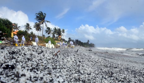 A cleanup operation on a beach covered in nurdles in May 2021