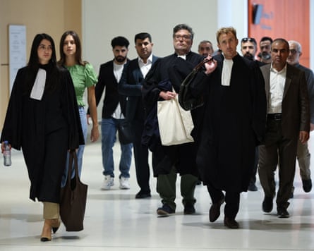 Crowd of people some in court dress