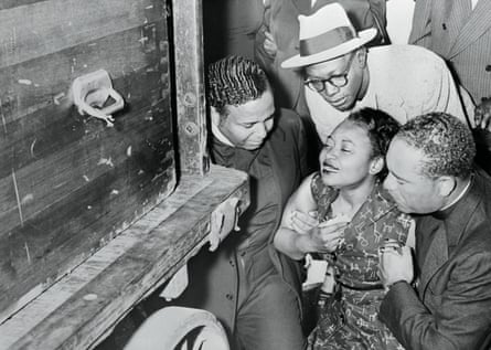 a women crying and men surrounding her