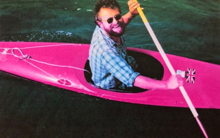 Christopher Thomas successful a canoe smiling up astatine nan camera