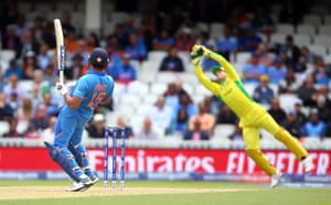 Rohit watches as Carey catches.