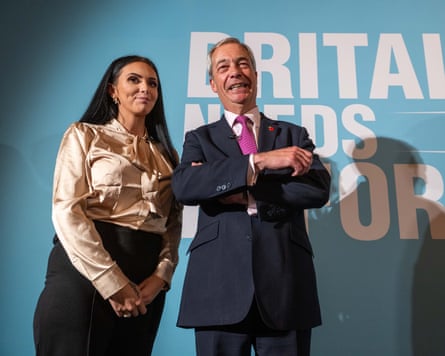 Ellie-Ann Reynolds and Nigel Farage standing in front of a Reform UK poster.