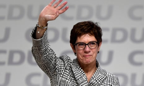 Annegret Kramp-Karrenbauer waves after being elected as the party leader during the Christian Democratic Union party congress.