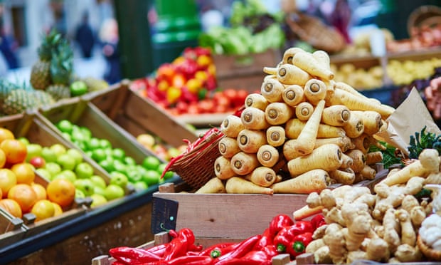 Pile ’em high: organic fruit and veg on sale.