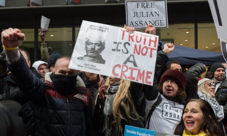 Supporters of Julian Assange cheer outside the Old Bailey in London