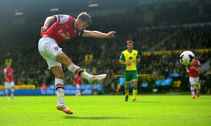 Aaron Ramsey volleys home the opening goal during Arsenal’s 2-0 win at Norwich City in May 2014.