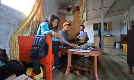 Israeli activists Rehut Maymon and Eyal Mazor learning Arabic, helped by a Palestinian girl in a home in the south Hebron hills.