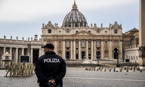 a policeman and an empty st peter's square in Rome