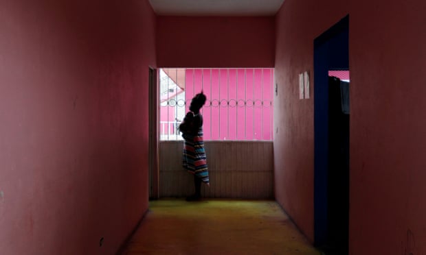 Edith Torres, 18, from Honduras stands with her newborn baby at a migrant shelter in Mexico.