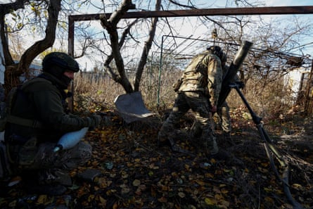 Ukraine forces fire towards Russian troops in the frontline town of Avdiivka
