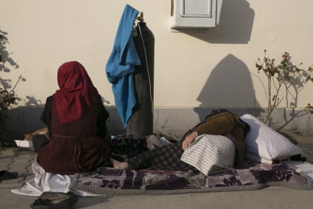 Patients are treated outside a hopsital in Kabul.