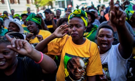 African National Congress supporters celebrate outside parliament in Cape Town