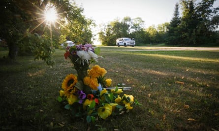 Flowers lie outside the house where one of the stabbing victims was found in Weldon, Saskatchewan.