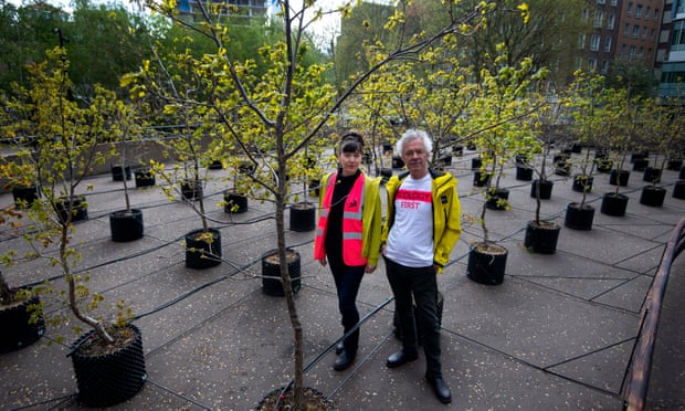 Artists Heather Ackroyd and Dan Harvey with their 100 oak saplings outside the Tate Modern.