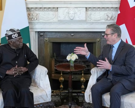 Nigeria takes its place on world stage in quest to become regional superpower Tinubu and Starmer sit beside a fireplace in front of the Nigerian and UK flags