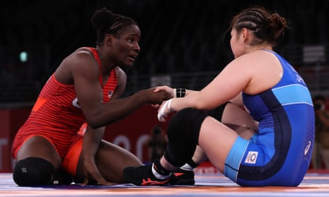 Tamyra Mensah-Stock commiserates with Sara Dosho of Team Japan after her victory during the women’s 68kg wrestling