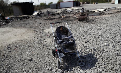 A partially burned pushchair in the remains of the Dunkirk camp.