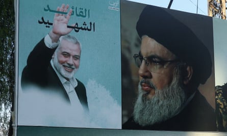 A poster depicting Hamas leader Ismail Haniyeh and Hezbollah leader Hassan Nasrallah, seen in Lebanon in September