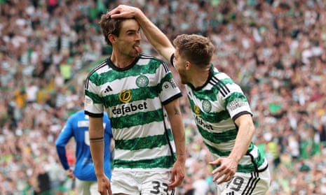 Matt O’Riley celebrates with James Forrest after putting Celtic 1-0 up against Rangers