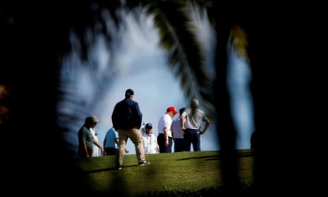 U.S. President Donald Trump plays golf at the Trump International Golf Club in West Palm Beach, Florida, before signing the Covid relief bill