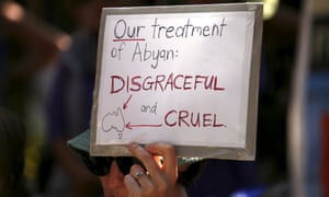 A protester holds a placard in support of 'Abaya'