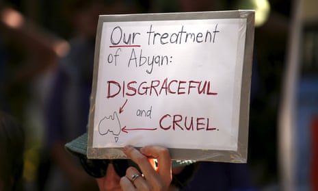 A protester supports refugees during a rally in Sydney. 